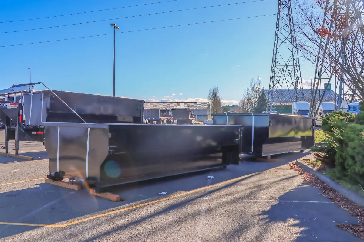 Roll-off dumpster ready for waste disposal at job site for Concrete Dumpster Rental in Quincy